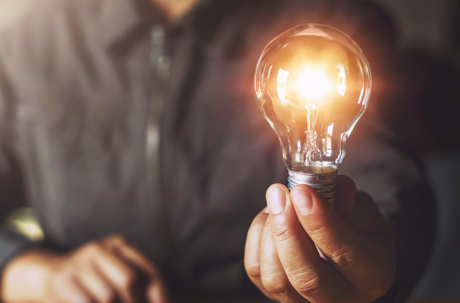 man holding lightbulb