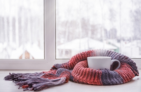 coffee and scarf on window sill